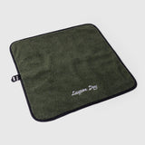 A small My Place dog bed in Ponderosa Pine color on a light grey background