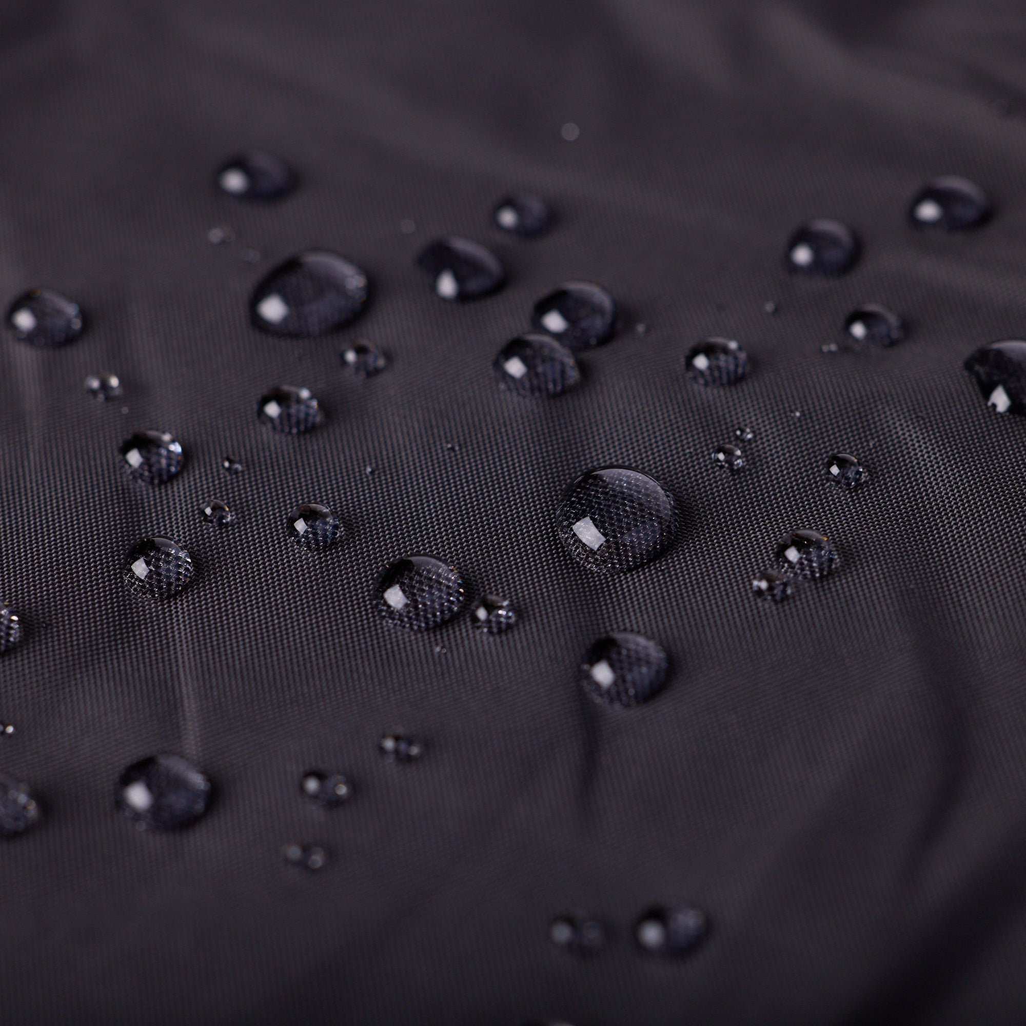 Water droplets on the bottom waterproof nylon side of a My Place dog bed