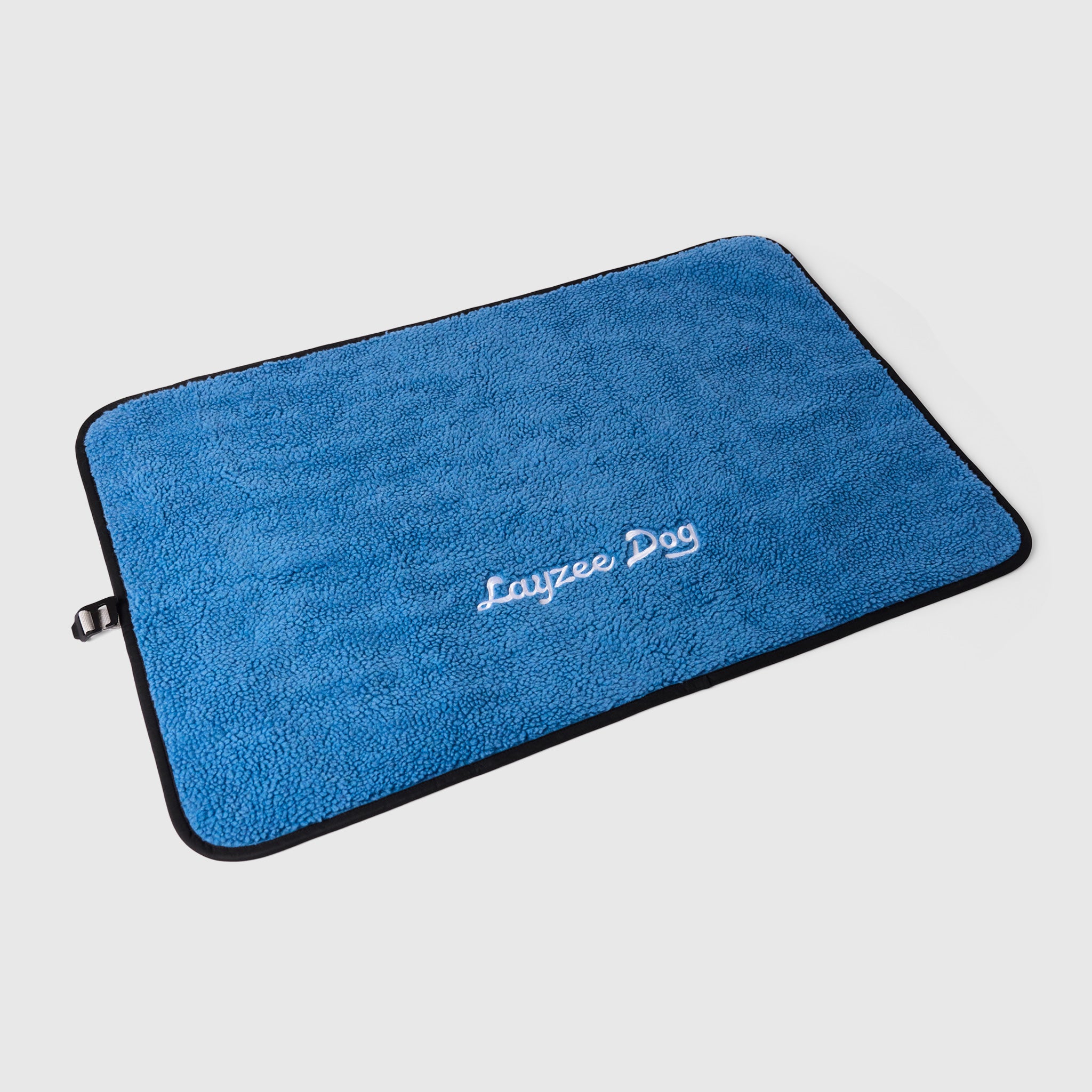 A large My Place dog bed in pinot noir color on a light grey background