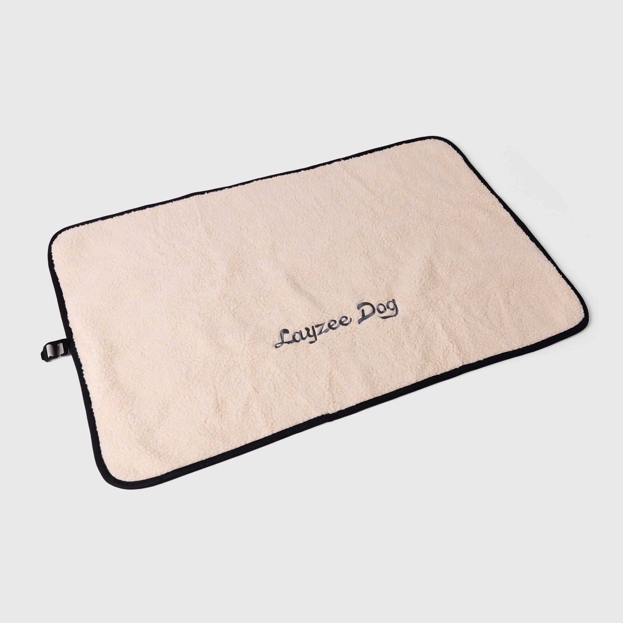 A large My Place dog bed in creme brulee color on a light grey background